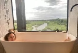 Bath with a view. Have a bath while watching elephant, buffalo and hippo below